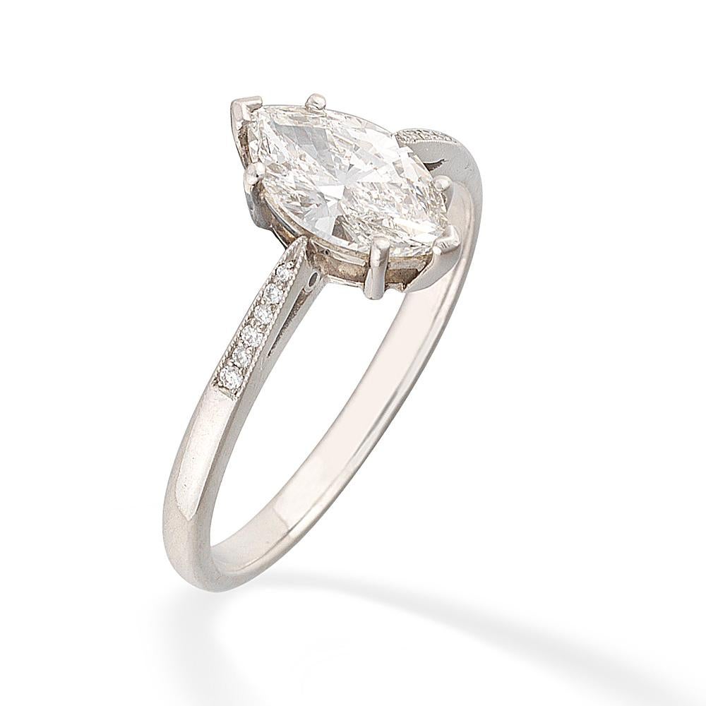 A single stone diamond ring, the marquise brilliant-cut diamond weighing 1.01 carats, accompanied by De Beers Report stating to be of G colour and VVS2 clarity, six claw-set to a platinum collet with plain pierced gallery, six graduated