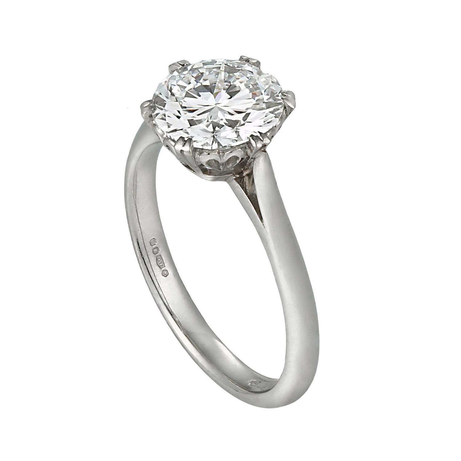 A solitaire diamond ring, the round brilliant cut diamond, weighing 2.05 carats of D colour IF clarity, GIA certificate, six-claw set in a heart shape platinum collet, with tapered D-section shank, hallmarked platinum, London 2010, bearing the