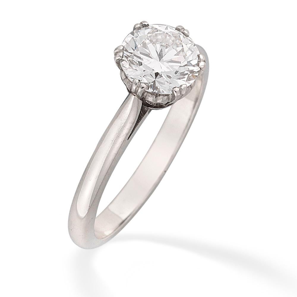 A single stone diamond ring, the round brilliant-cut diamond weighing 1.18 carats of D colour and IF clarity, with GIA certificate , six-claw set to a platinum heart collet with D-section shank and tapered shoulders, hallmarked platinum, London