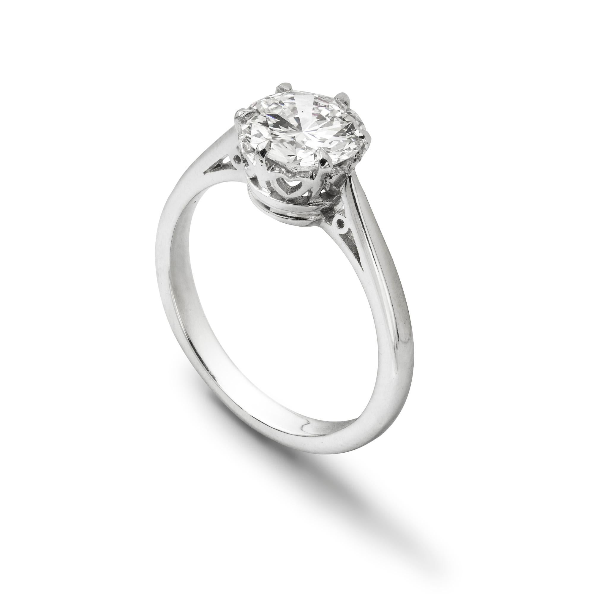 A single stone diamond ring, the round brilliant-cut diamond weighing 1.51 carats of D colour and VVS1 clarity, GIA certificate, six-claw set to a white gold mount with square-section tapered shank and cheniered shouldes, hallmarked 18 carat gold,