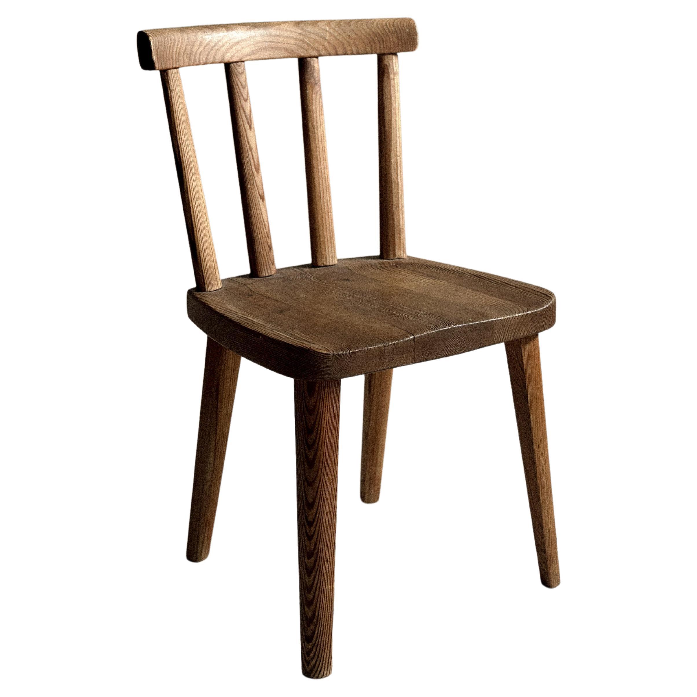 A single Utö Dining Chair by Axel Einar Hjorth for Nordiska Kompaniet, 1930s For Sale