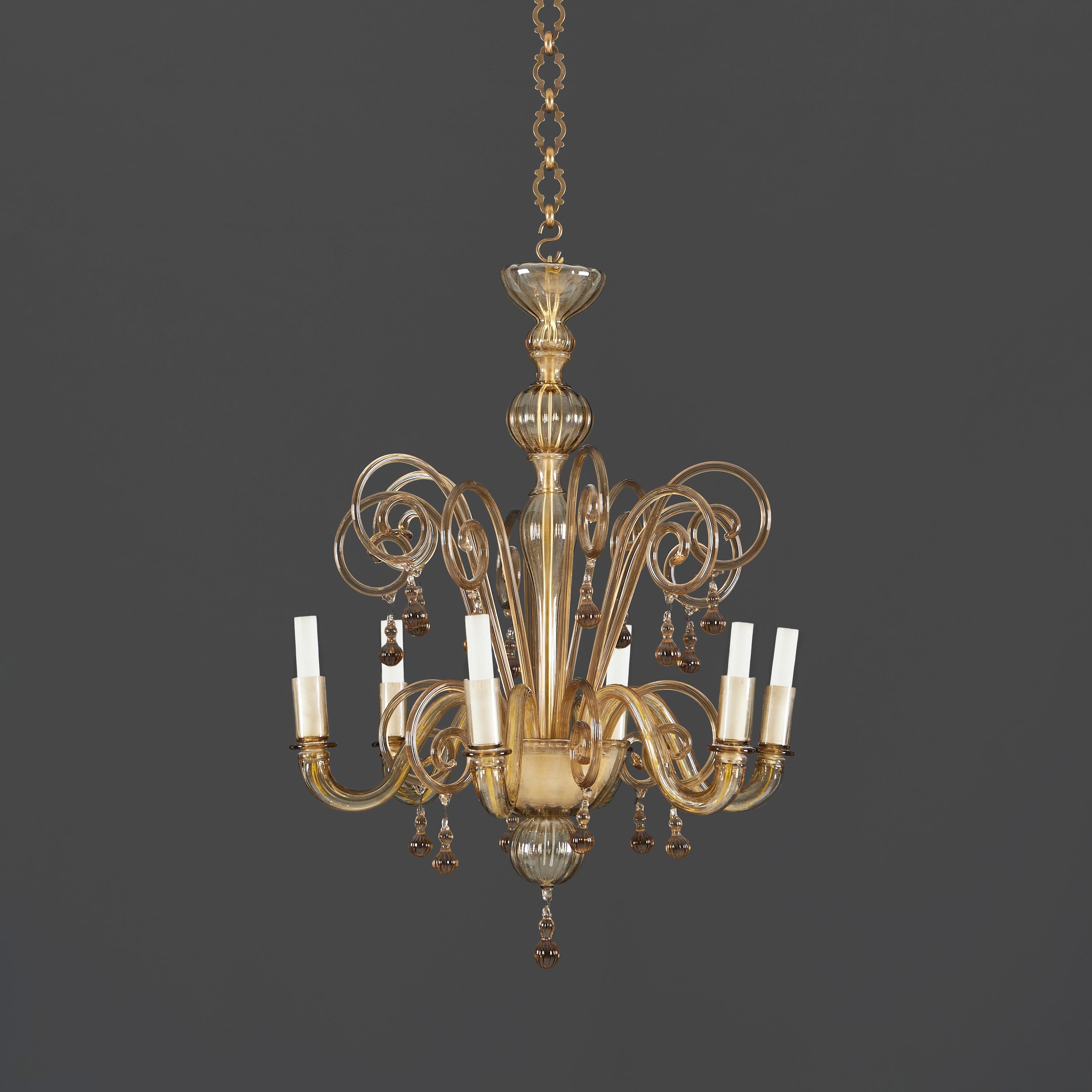 An early twentieth century Murano glass chandelier, with six candle arms, of small scale interspersed with scrolling tendrils with glass droplets.

Please note:
Currently wired for the UK with e14 candle bulb fittings. Please enquire for rewiring
