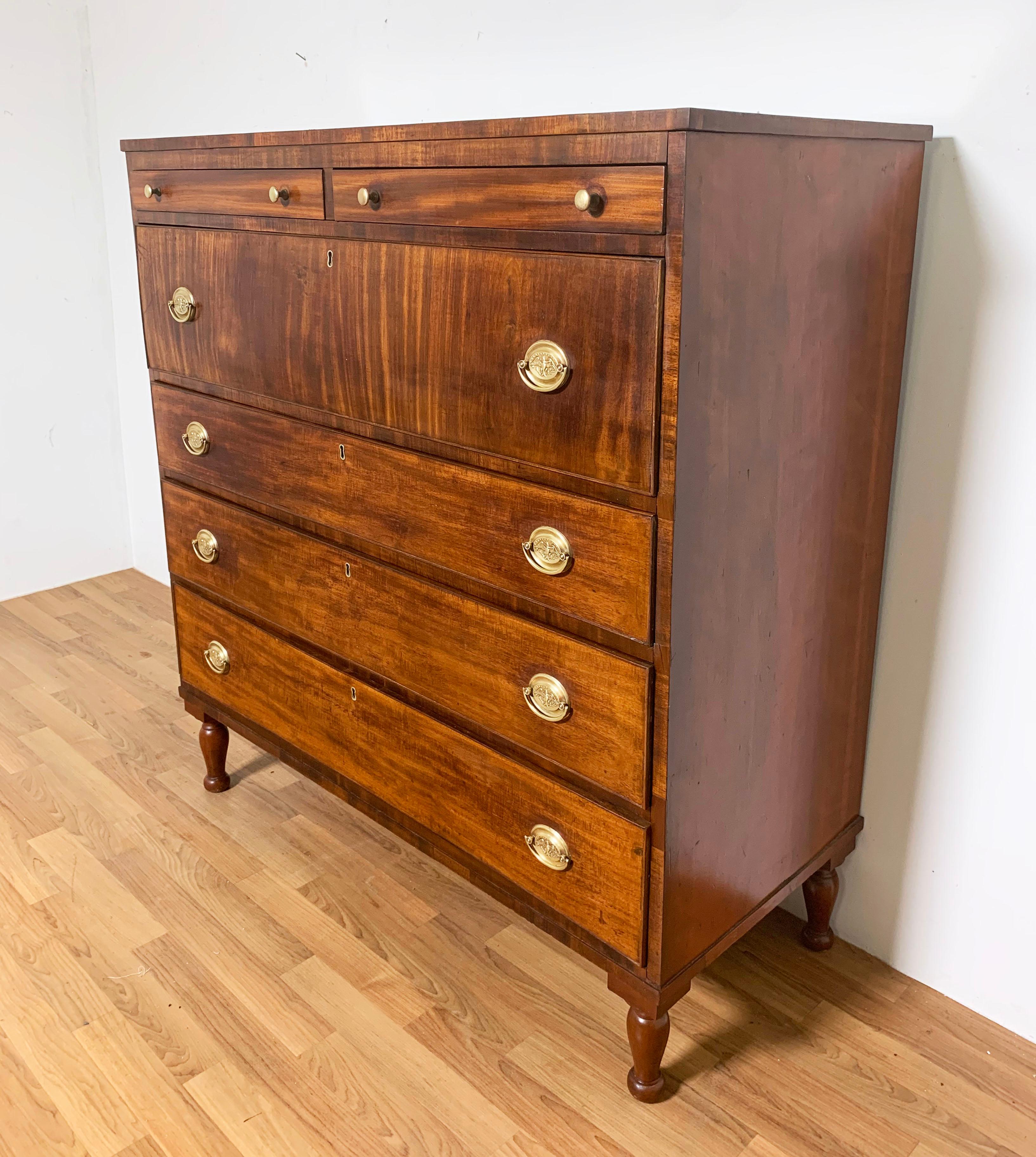 An attractive mahogany dressing chest of two drawers over four from the island of Nantucket. Features a deep center drawer for woolens and above three graduated drawers circa 1820s.