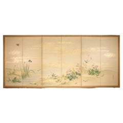 A six-panel folding screen depicting a floral and a naturalistic scene