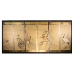 A six-panel folding screen of symbolic animals and peonies