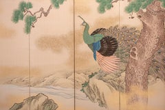 A six-panel folding screen on paper with gold dust depicting a majestic peacock