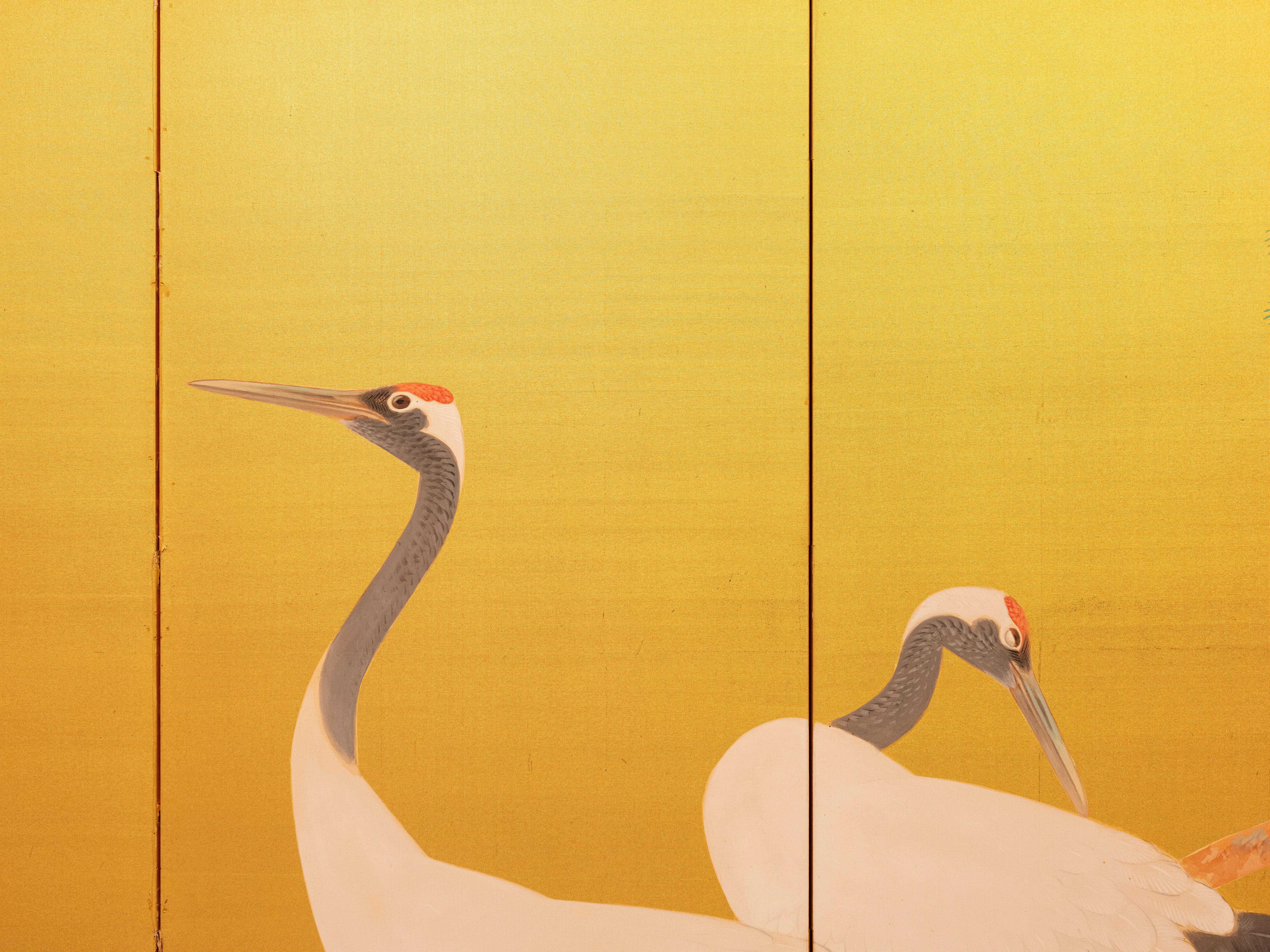 Sechstafeliger Paravent mit einem Paar mandschurischer Kraniche auf vergoldeter Seide (Handbemalt) im Angebot