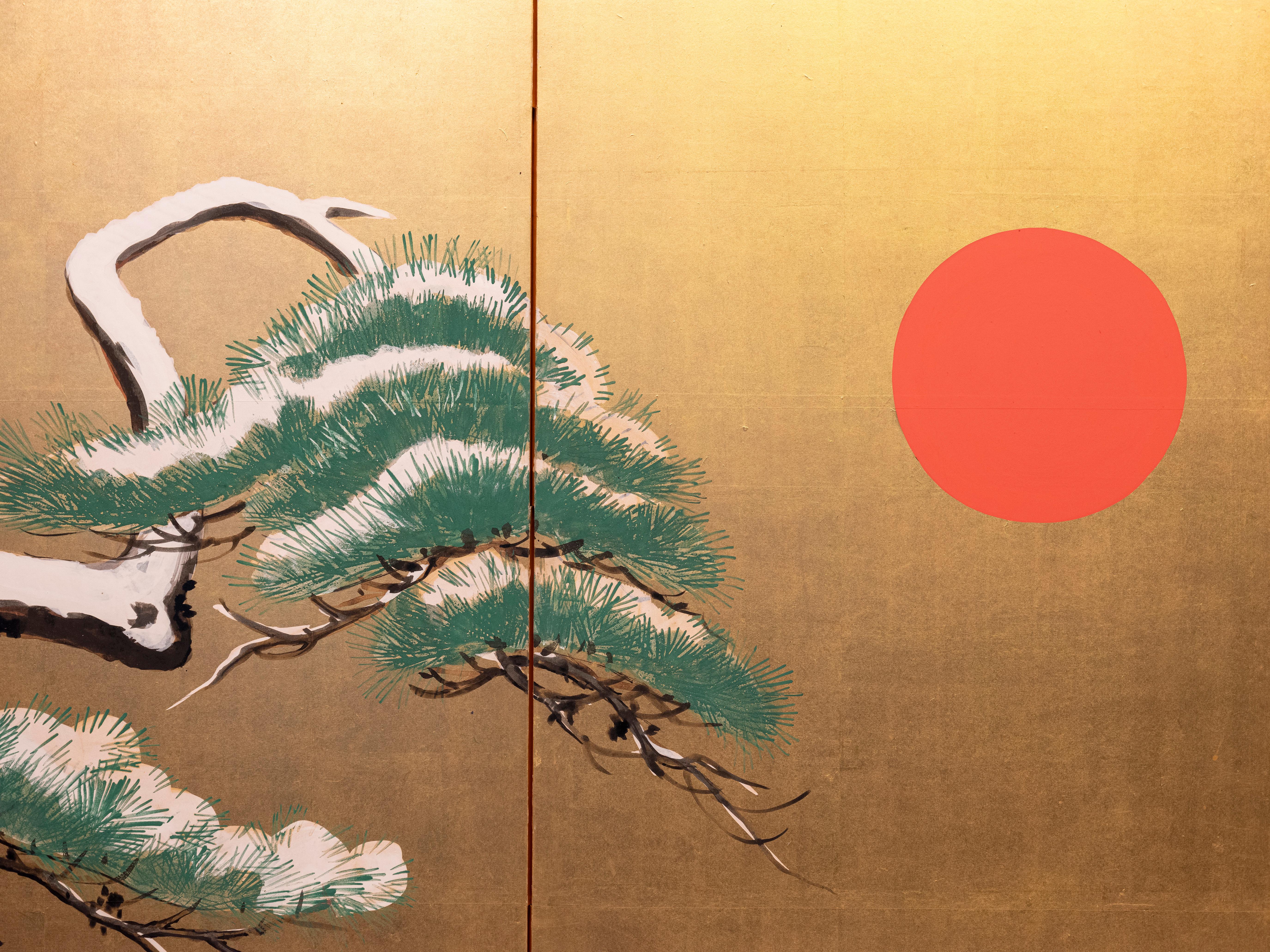 Gold Leaf A six-panel folding screen with pine trees beneath the red sun For Sale