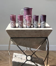 A six-piece set of hand-blown purple art glass pitcher and glasses, late 20th c