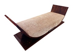 A Sleek French Art Deco Macassar Ebony Gondola Daybed
