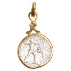 A "Slinger" & Wrestlers Coin Pendant