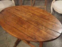 A Small 19th Century Carved Oak Tilt-Top Wine Tasting Table from France