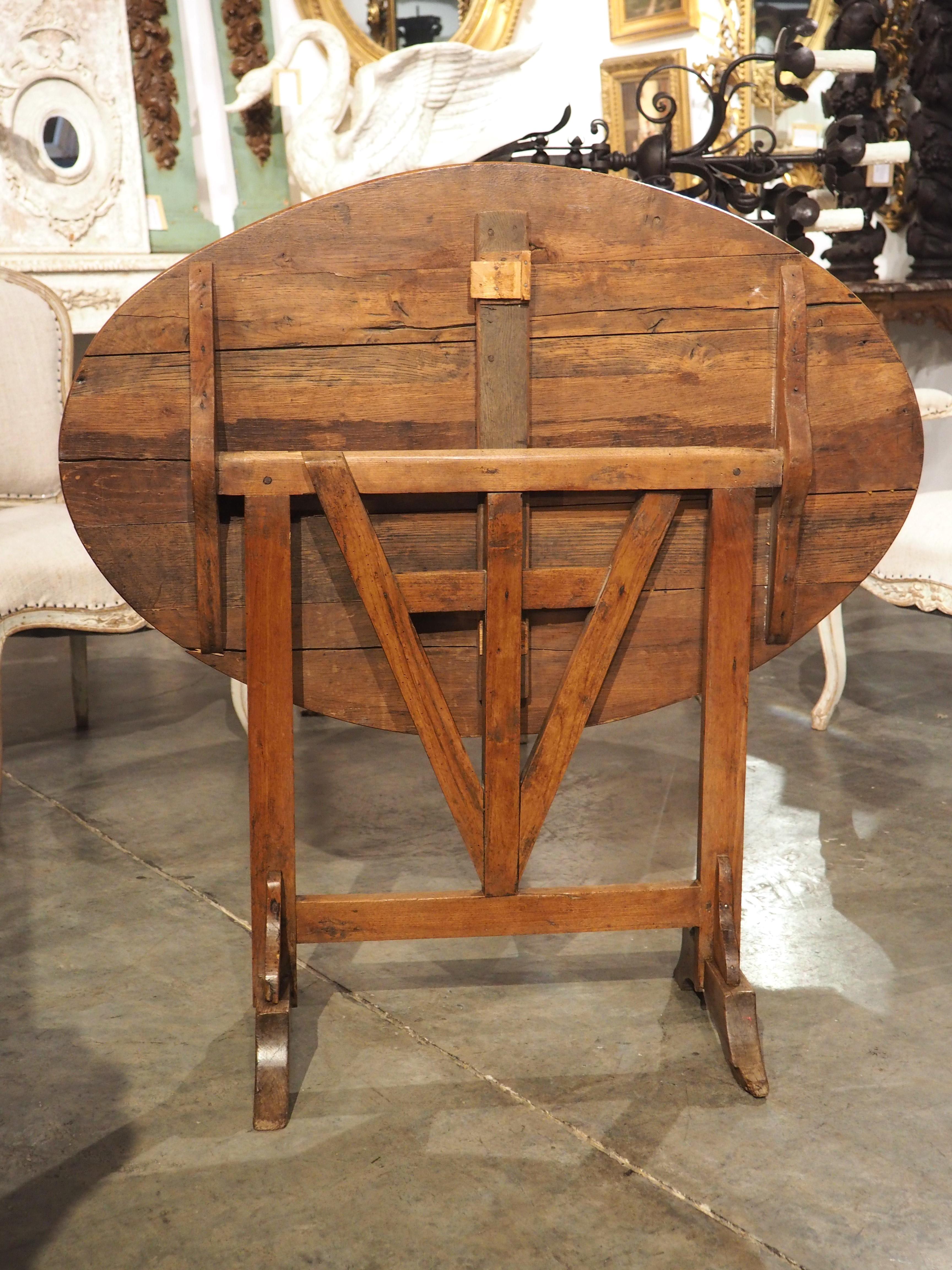 Wood A Small 19th Century Carved Oak Tilt-Top Wine Tasting Table from France