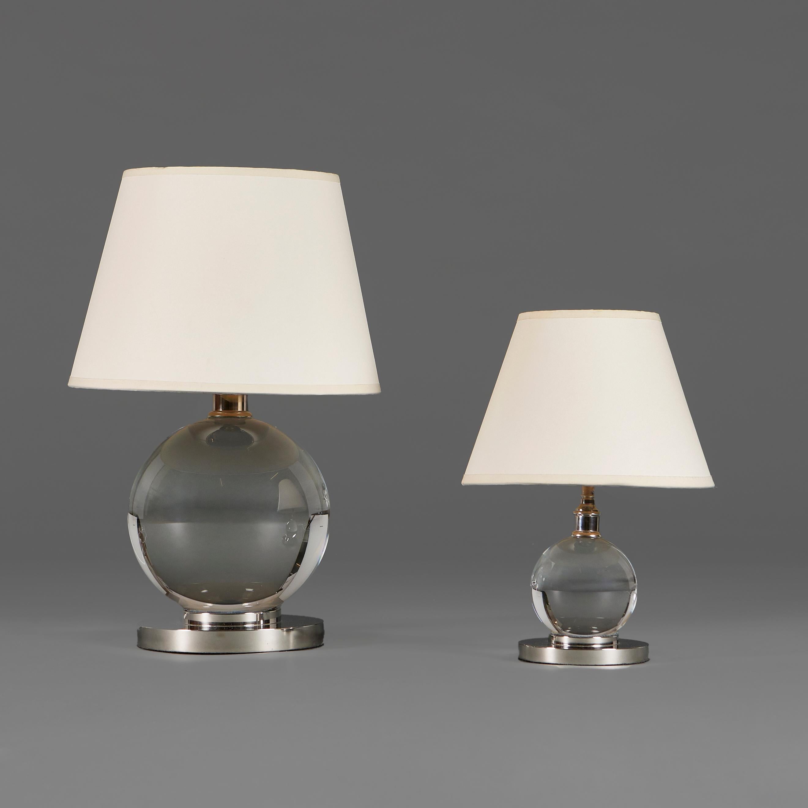 +VAT

England, modern

A crystal ball lamp with a silver base, after a design by Jacques Adnet.
Lead time: 6-8 weeks. Please enquire for stock availability.

Height of lamp 14.00cm
Height with shade 34.00cm
Diameter of base 12.00cm

Please