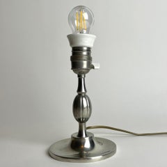 A small and elegant Table Lamp in Pewter Swedish Grace from the year 1930.