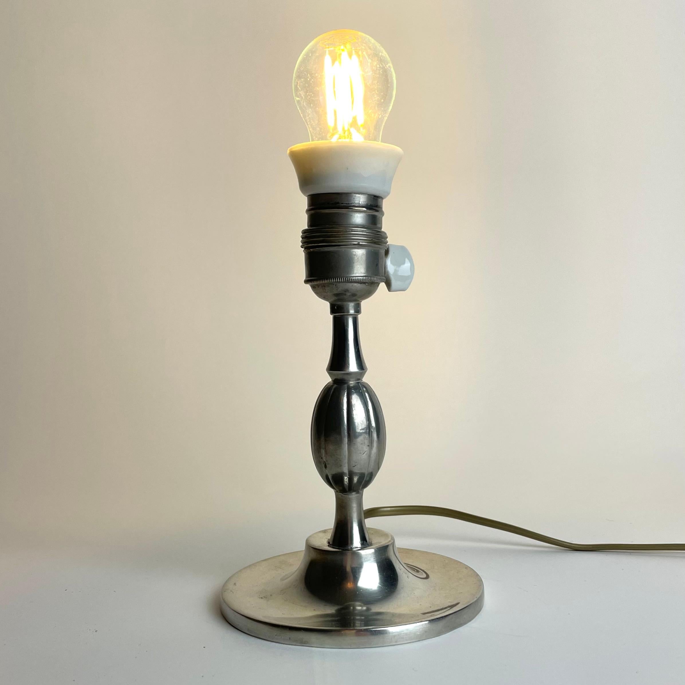 Art Deco A small and elegant Table Lamp in Pewter Swedish Grace from the year 1930. For Sale