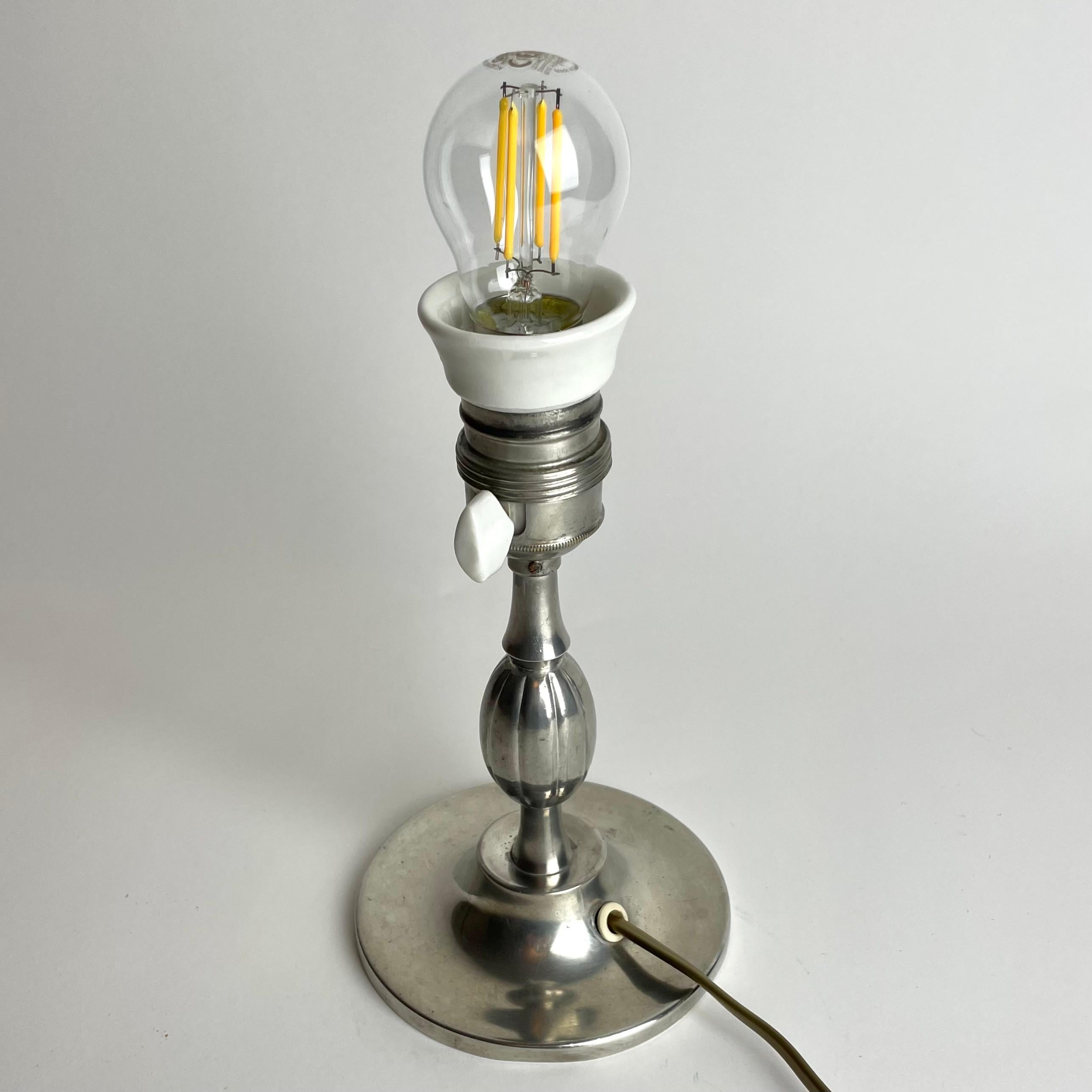 Mid-20th Century A small and elegant Table Lamp in Pewter Swedish Grace from the year 1930. For Sale