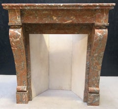 Small and Lovely Antique Fireplace in Soft Colors