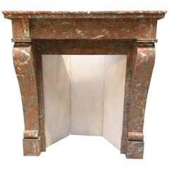 Small and Lovely Antique Fireplace in Soft Colors