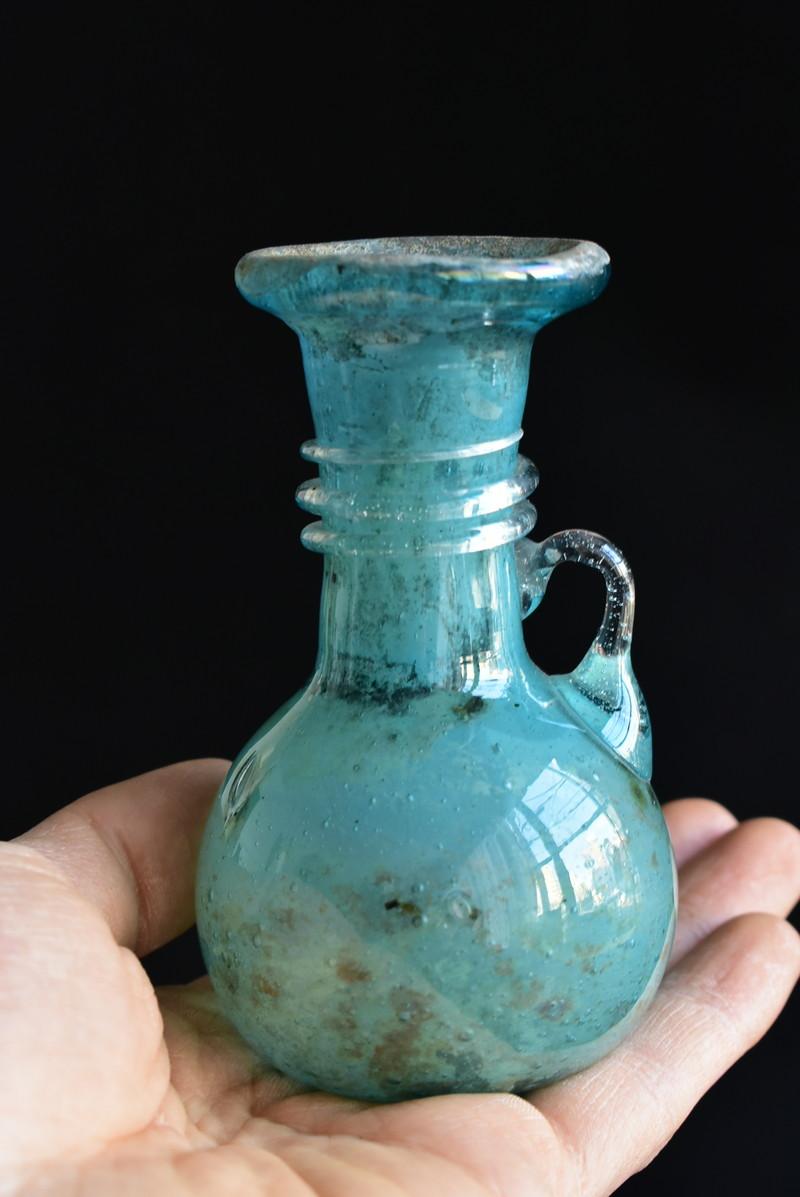 At first, glass was as valuable as a jewel and became a familiar ornament in Roman times.

This is the same design as an ancient glass bottle made in the Eastern Mediterranean, Iran, or Italy.
Perhaps this item is a glass container made to