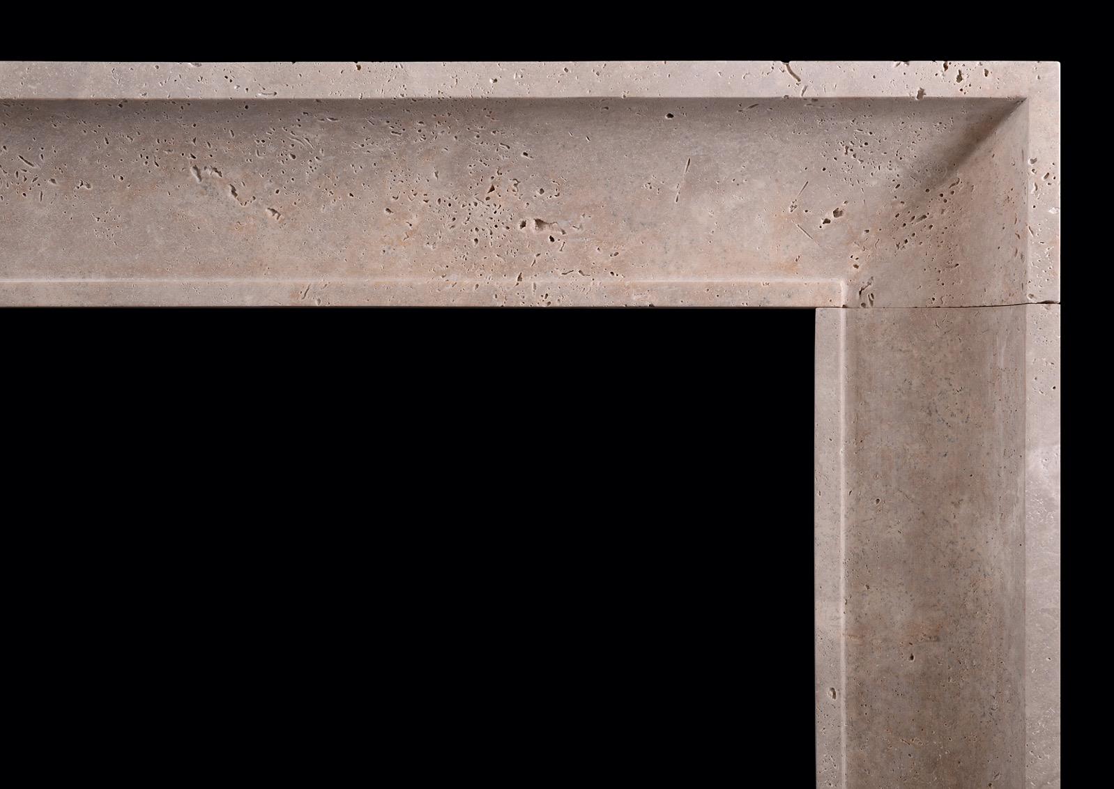 A small, architectural fireplace in Travertine stone. The jambs and frieze with concave moulding with plinths below. English. Modern.

Shelf Width:	1224 mm      	48 ¼