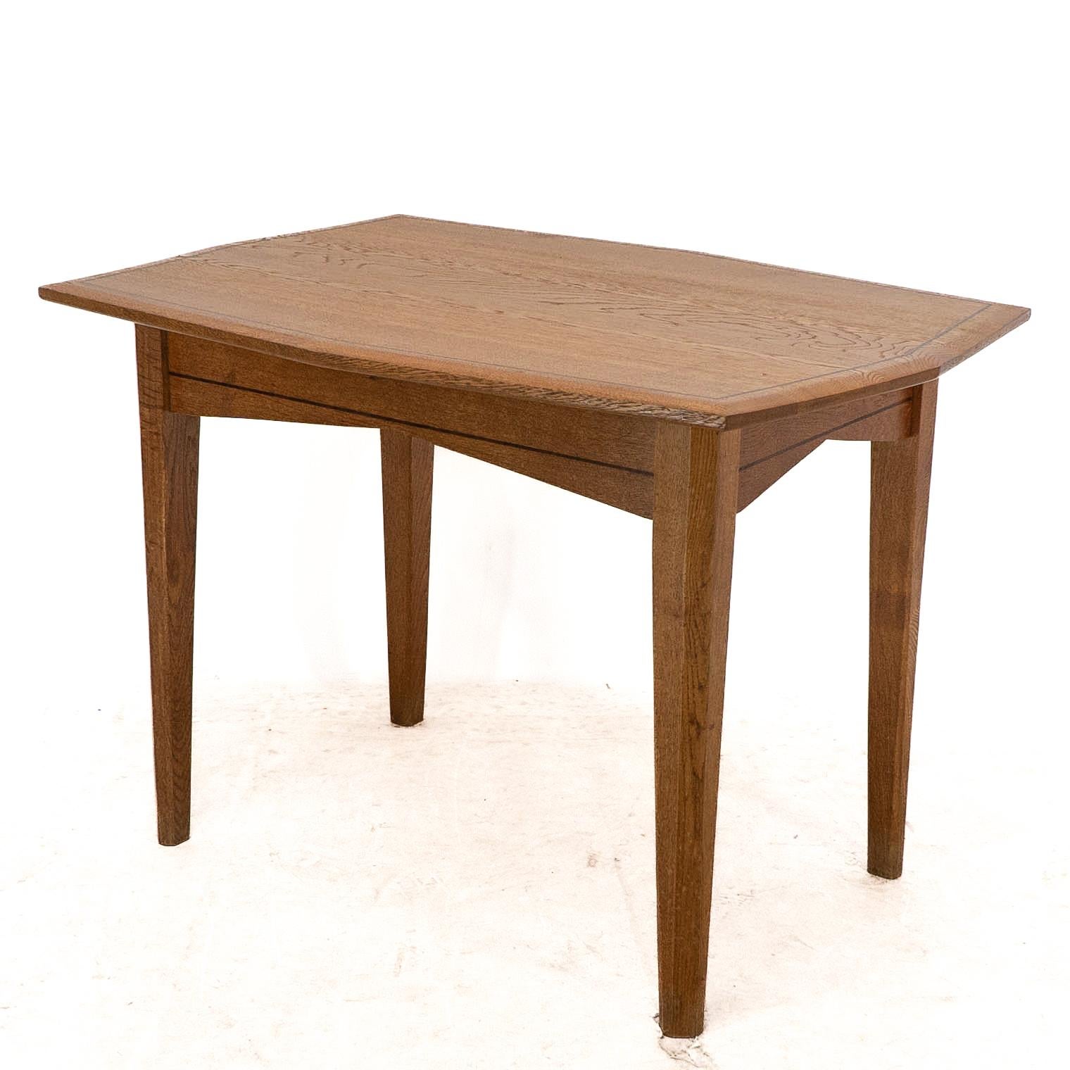 Arts and Crafts A small Arts & Crafts Cotswold style oak dining or centre table angular designs For Sale