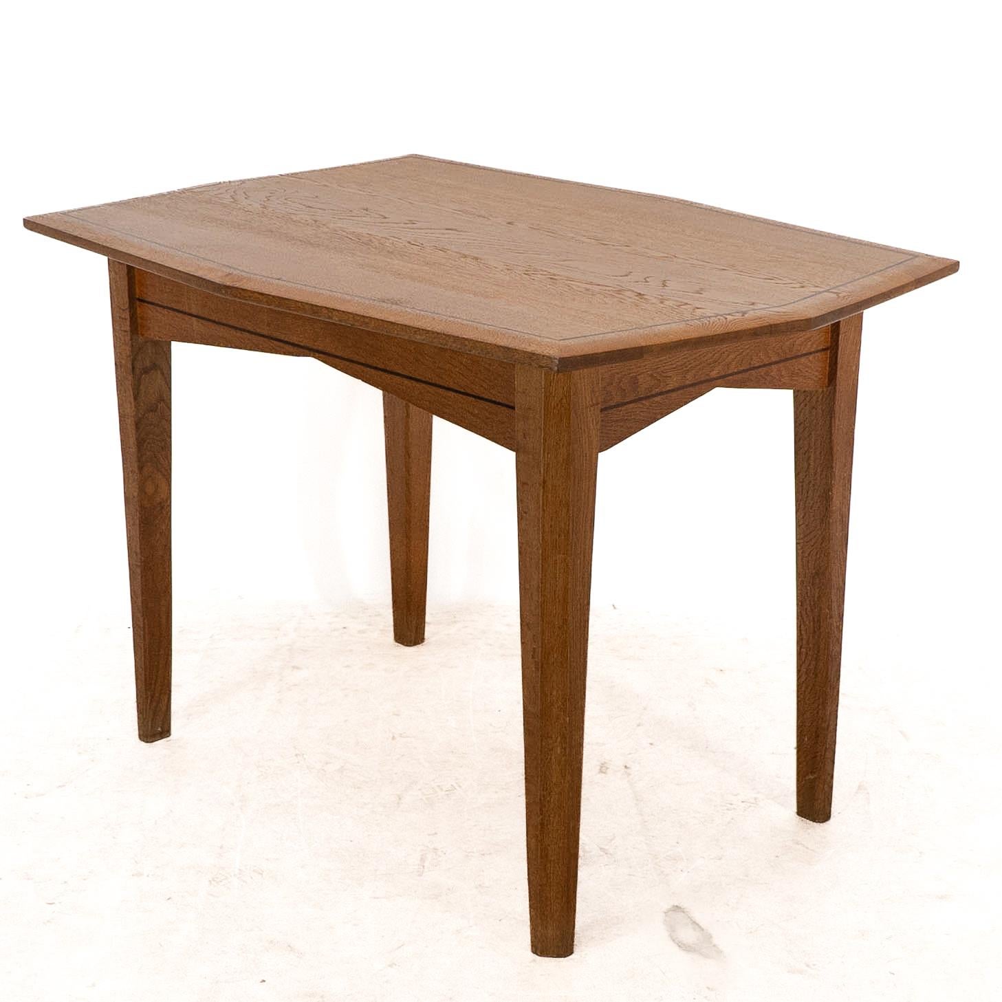Early 20th Century A small Arts & Crafts Cotswold style oak dining or centre table angular designs For Sale