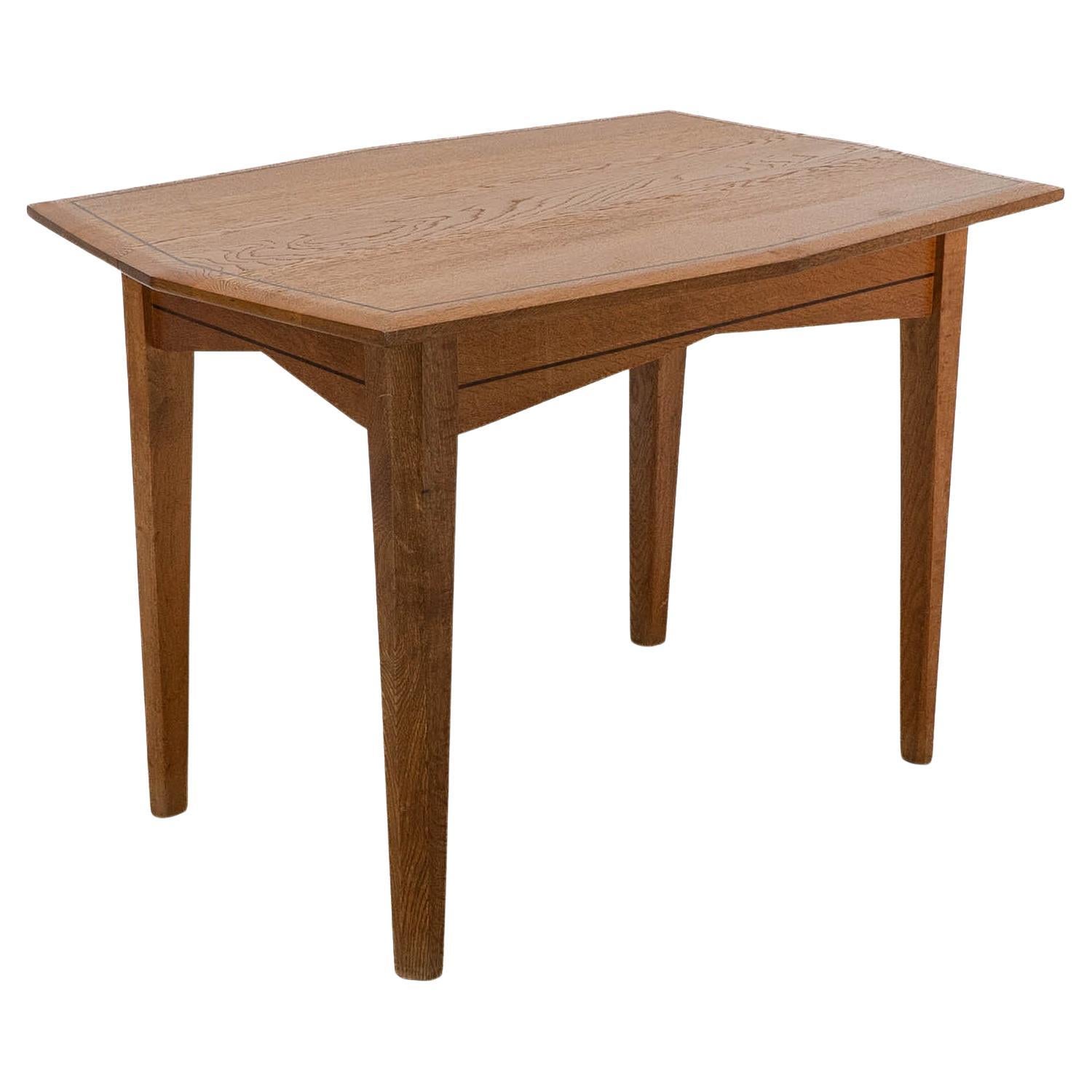 A small Arts & Crafts Cotswold style oak dining or centre table angular designs For Sale