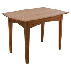A small Arts & Crafts Cotswold style oak dining or centre table angular designs