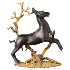 Antique A Small Bronze Group of a Prancing Stag