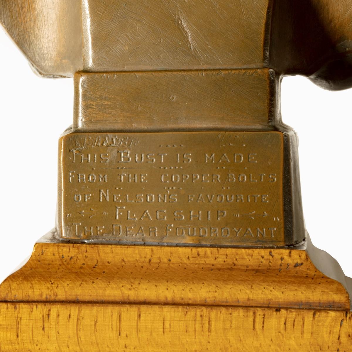 A small bust of Admiral Lord Nelson made from H.M.S. Foudroyant copper and oak, the likeness rendered in greenish copper and set on a stepped oak socle, engraved “This bust is made from the copper bolts of Nelson’s favourite Flagship The Dear
