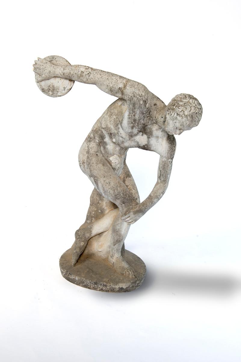 A small cement statue of a discus thrower, Discobolus.