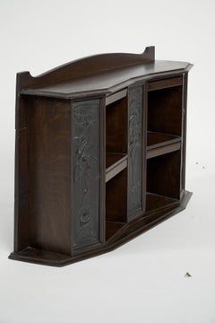 Arts and Crafts oak desk top bookcase with 3 bronze Art Nouveau period plaques.