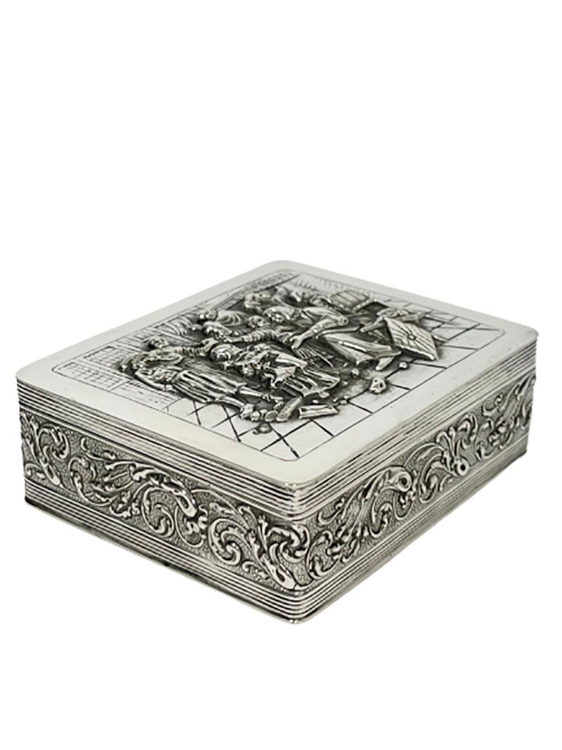 A small Dutch silver box with a 17th century scene after a painting by Jan Steen.

The scene of 
