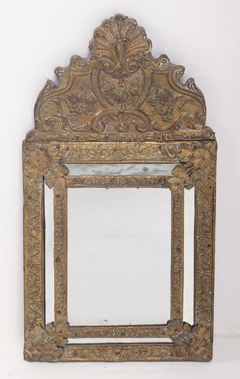 Baroque A small Dutch style brass repouse mirror circa 1890. For Sale