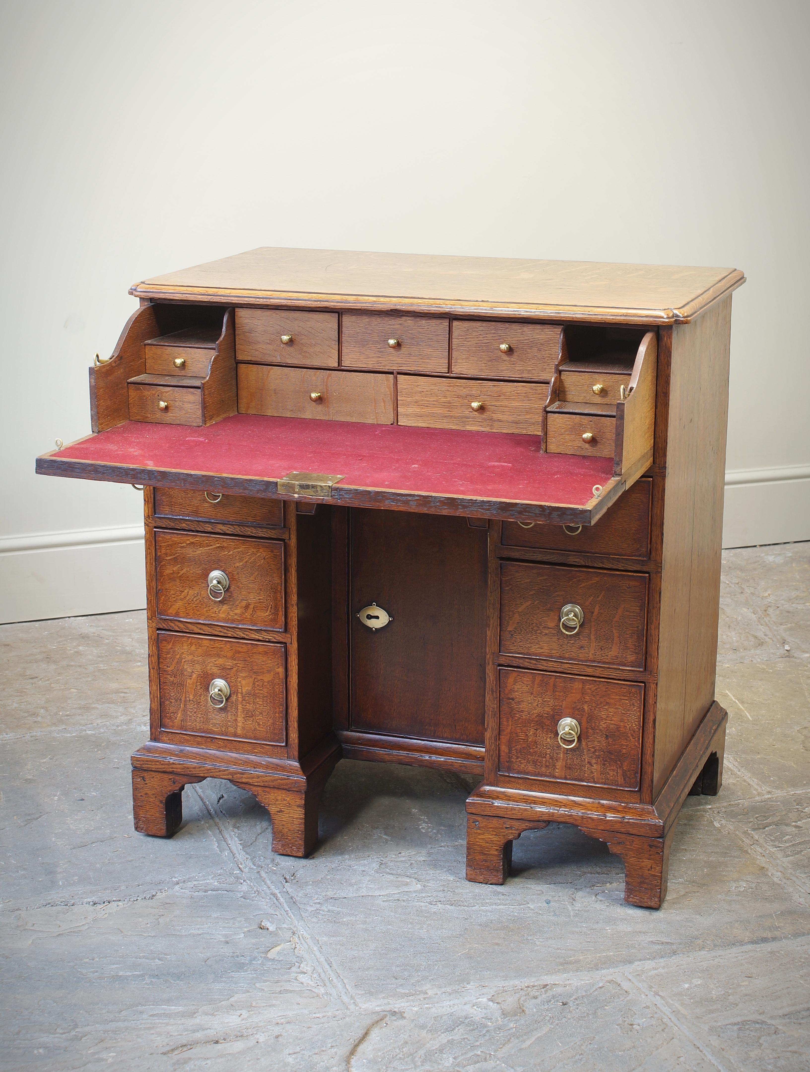 Brass  A Small English 18th Century Oak Secretaire Kneehole Desk For Sale