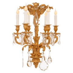 A small French 19th century Louis XV st. Ormolu and Crystal chandelier