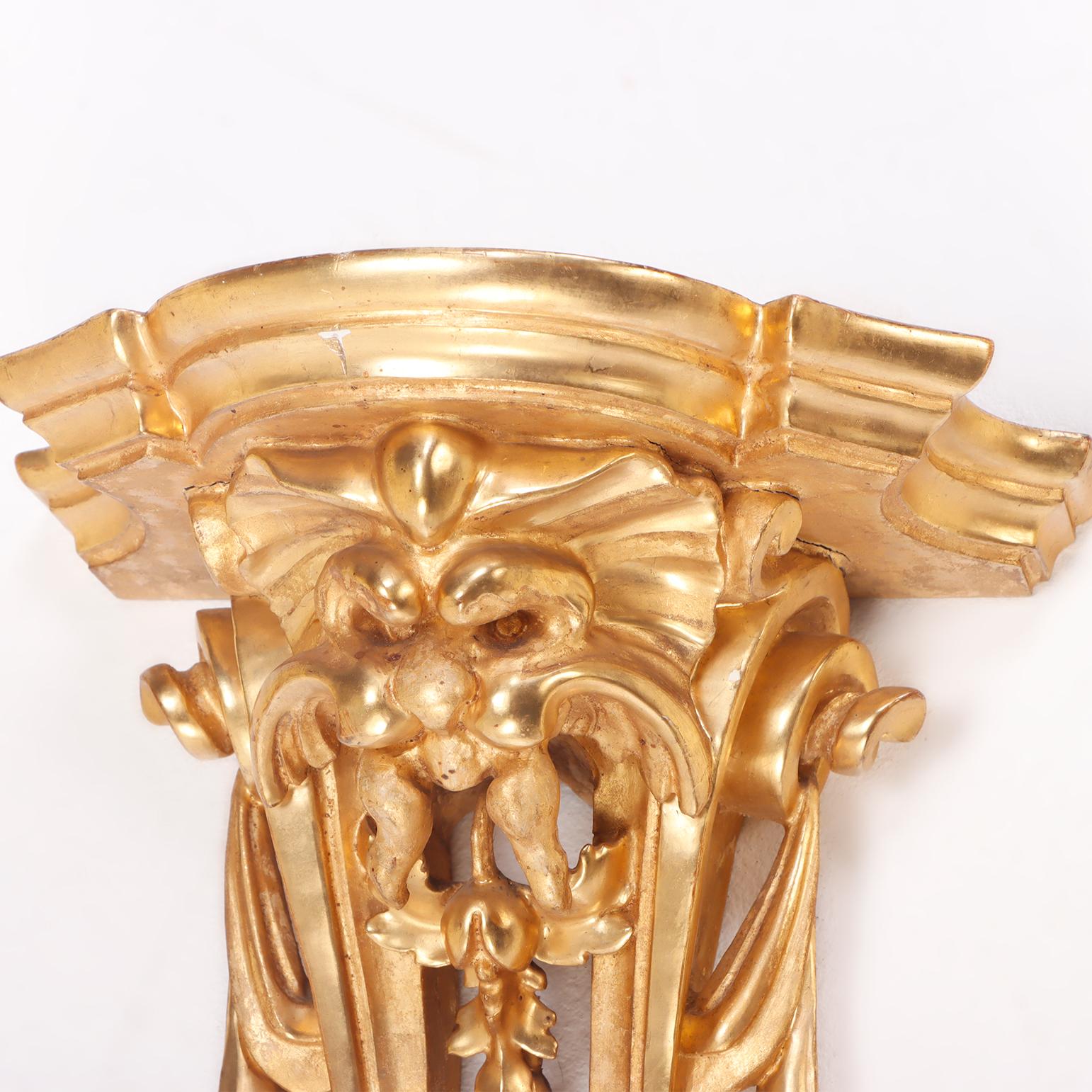 Giltwood A small French gilt and carved wood wall mounted shelf circa 1880. For Sale