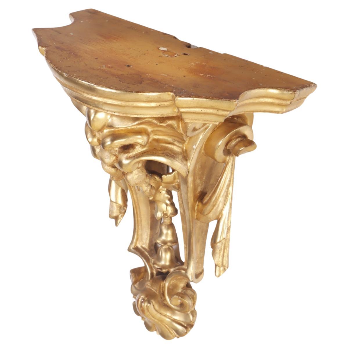 A small French gilt and carved wood wall mounted shelf circa 1880. For Sale
