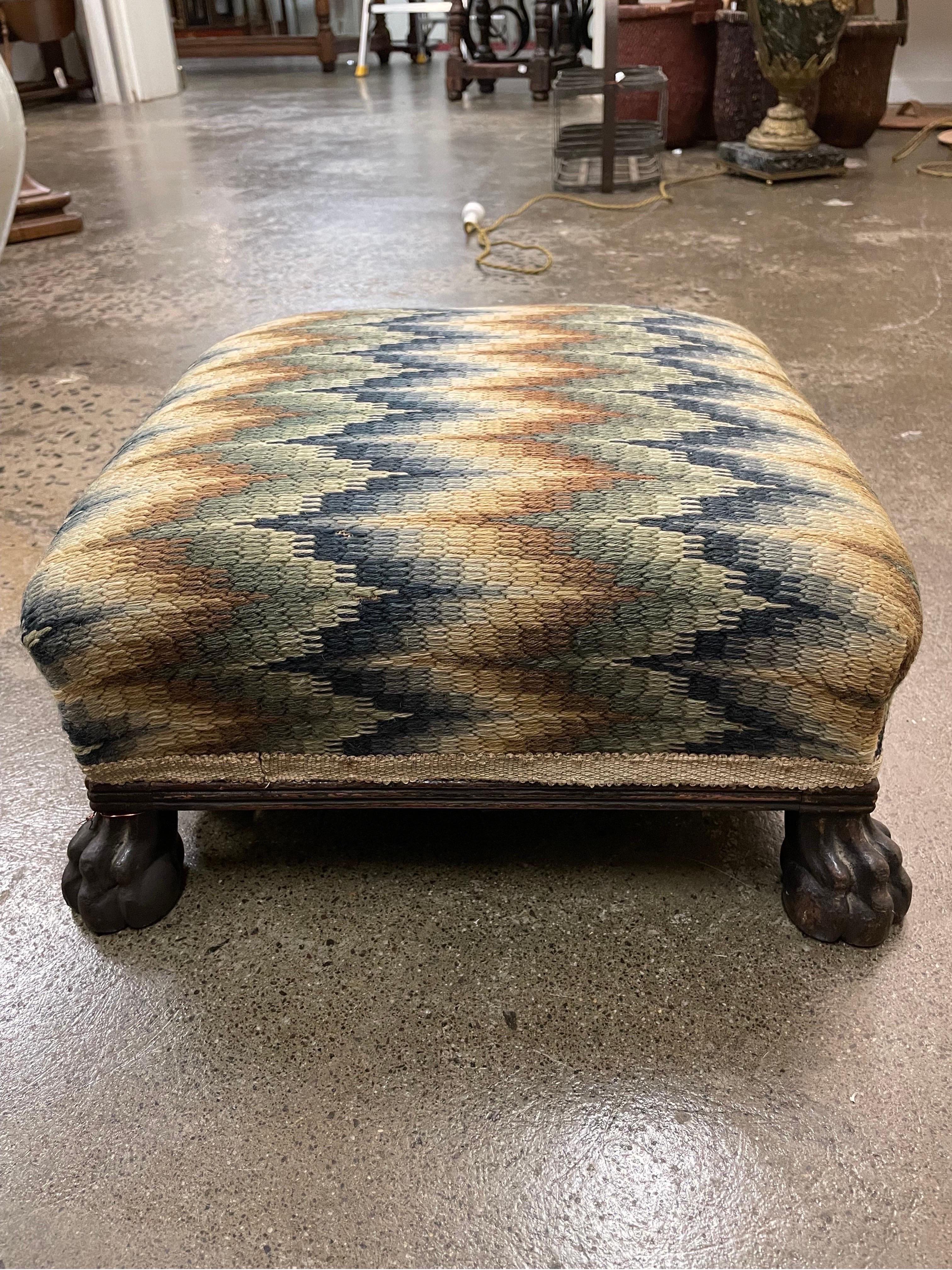 A Small Georgian Oak Footstool, Early 19th Century

With a reeded frame and raised on claw feet, covered in wool bargello needlework.

Provenance: Private New South Wales Collection.