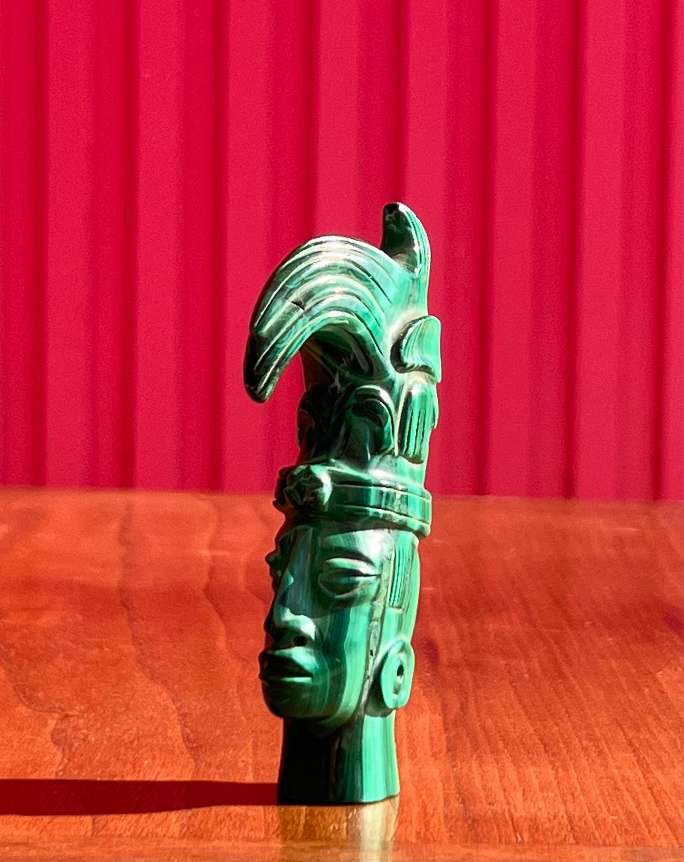 Hand-Carved A small hand-carved malachite sculpture of an indigenous tribesman, 20th century For Sale