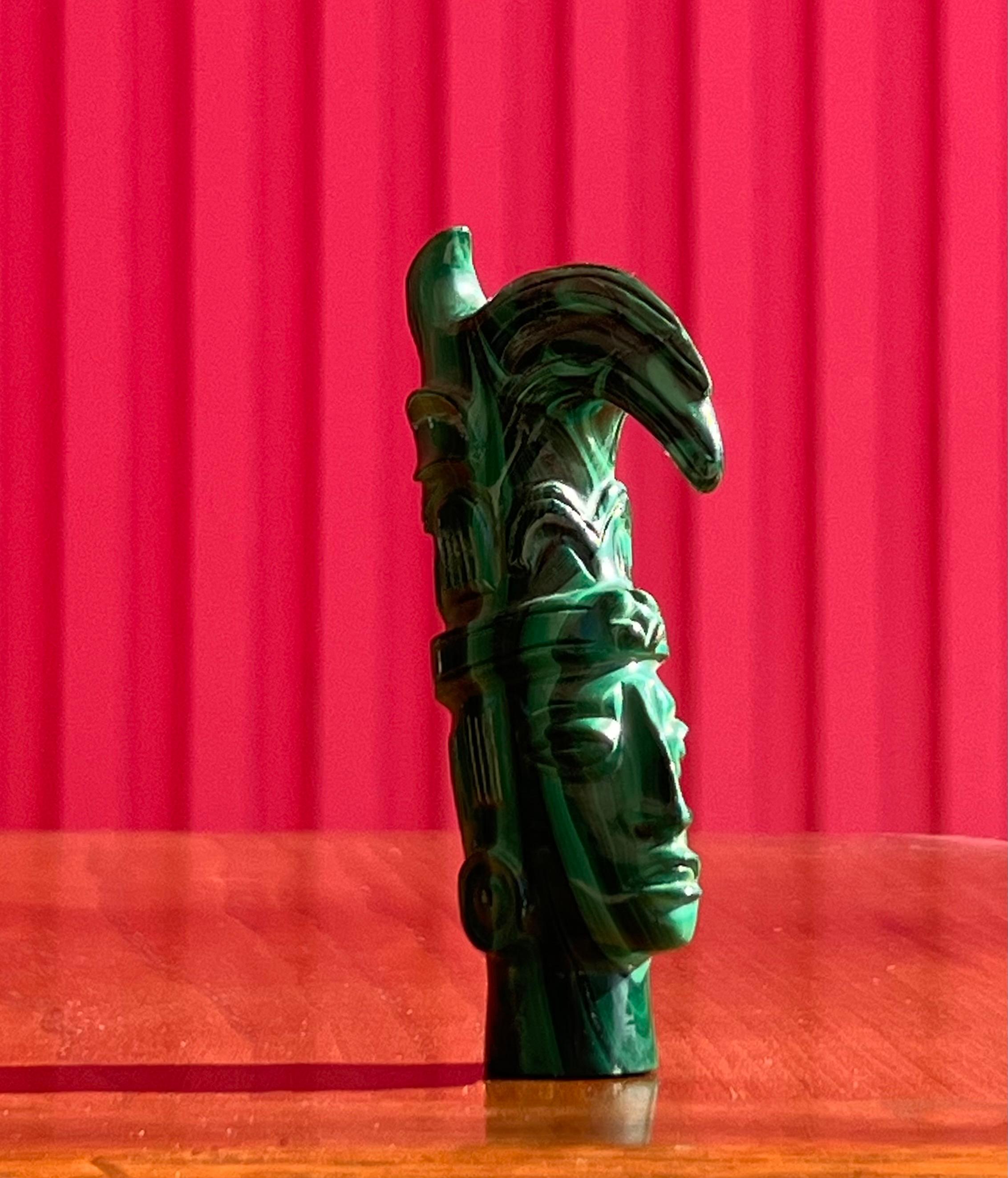 A small hand-carved malachite sculpture of an indigenous tribesman, 20th century In Good Condition For Sale In View Park, CA