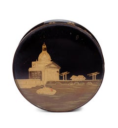 A small Japanese export lacquer circular box with a depiction of the Muiderpoort