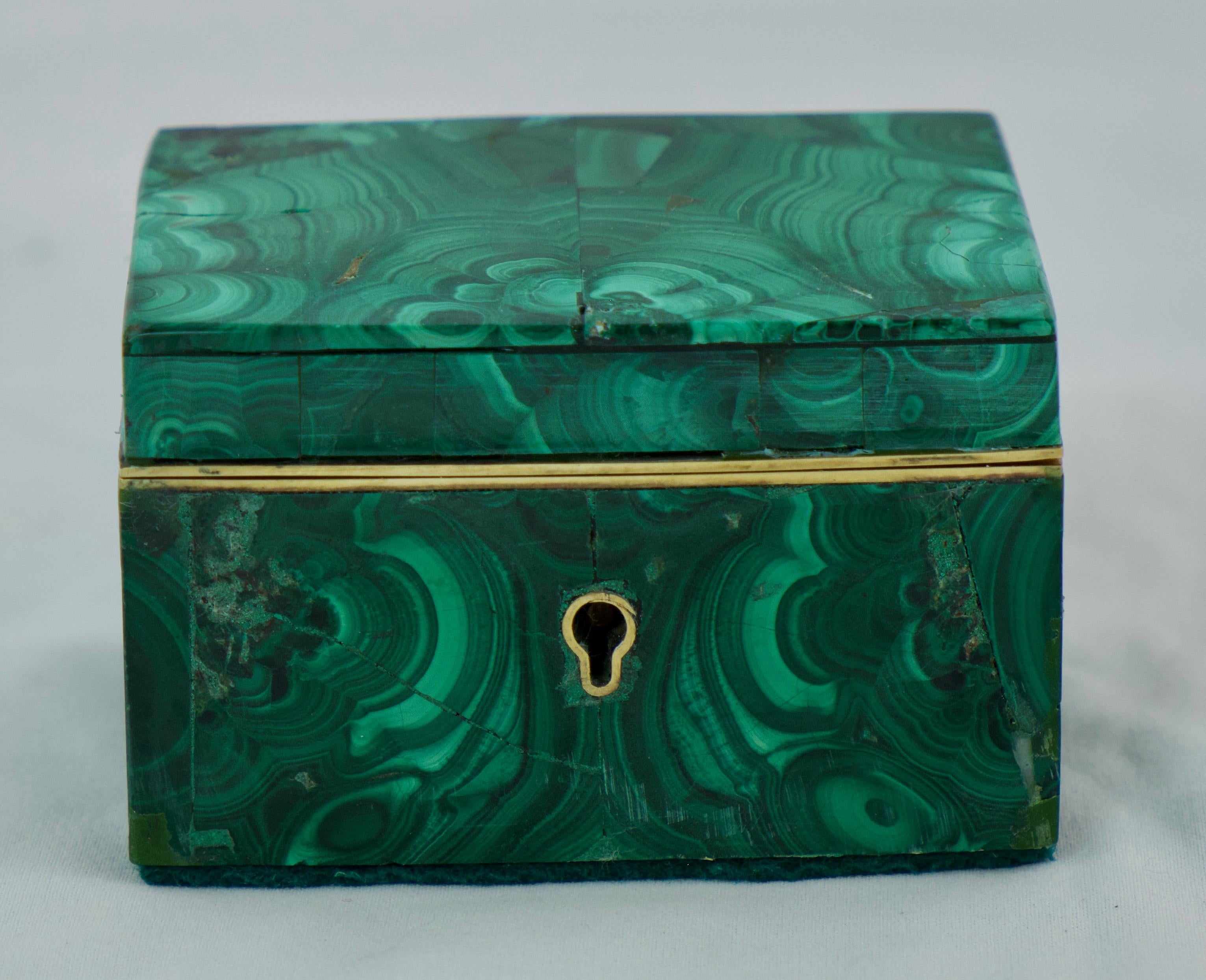 A small Russian malachite box veneered with malachite. Good quality and would be perfect for any piece of jewellery you want to put in it. It will look great on any table with its intense green colour.