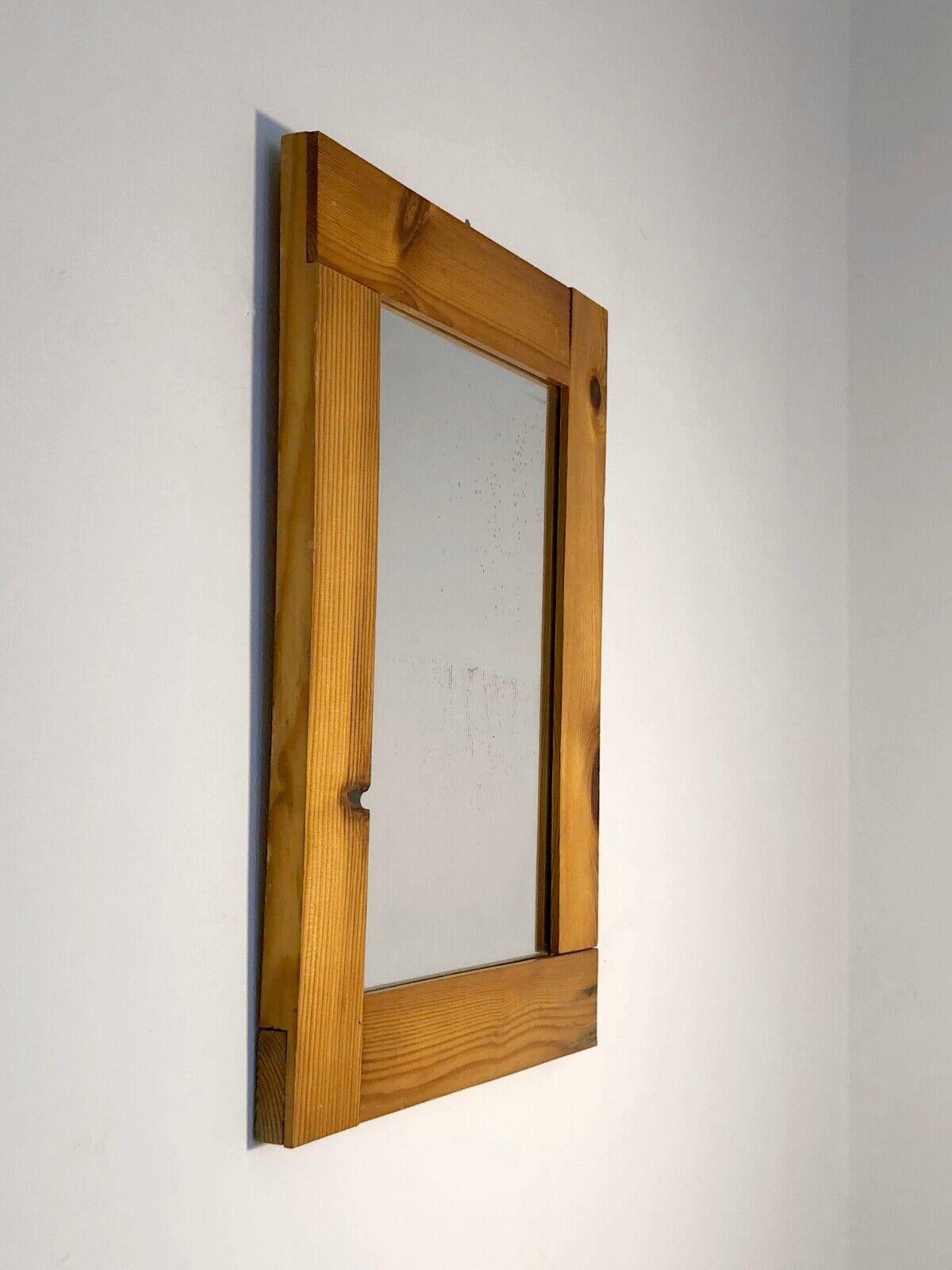 A small rectangular mirror, Modernist, Constructivist, Bauhaus, with a frame made of 4 pine strips nested within each other in an asymmetrical and very graphic manner, in the spirit of ski resort interiors, to be attributed, France