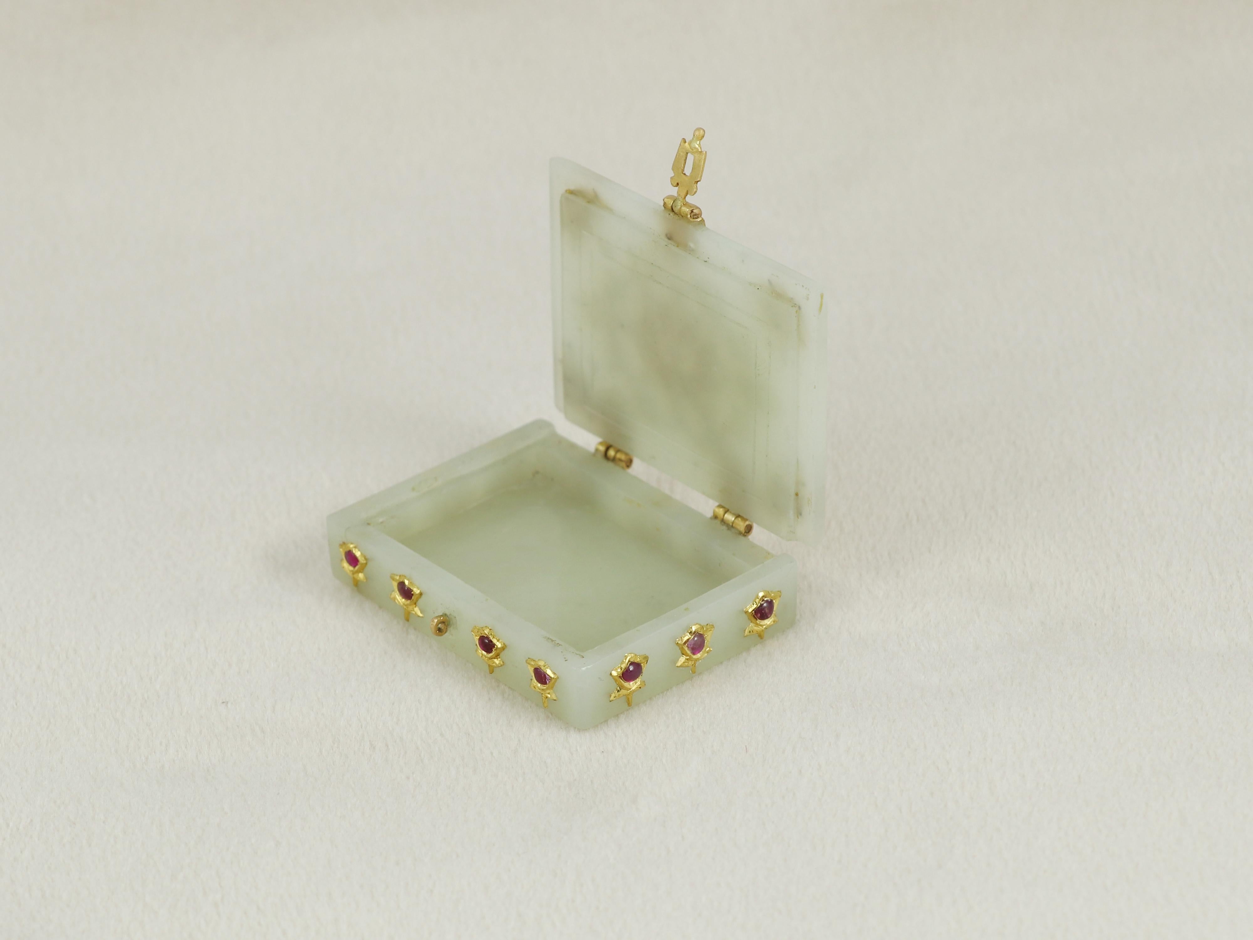 A small carved rectangular white celadon nephrite jade box meant for keeping small everyday things like tobacco, vermillion, mints strips or anything precious to the beholder of the box.

Made from a single piece of jade the box is finely crafted