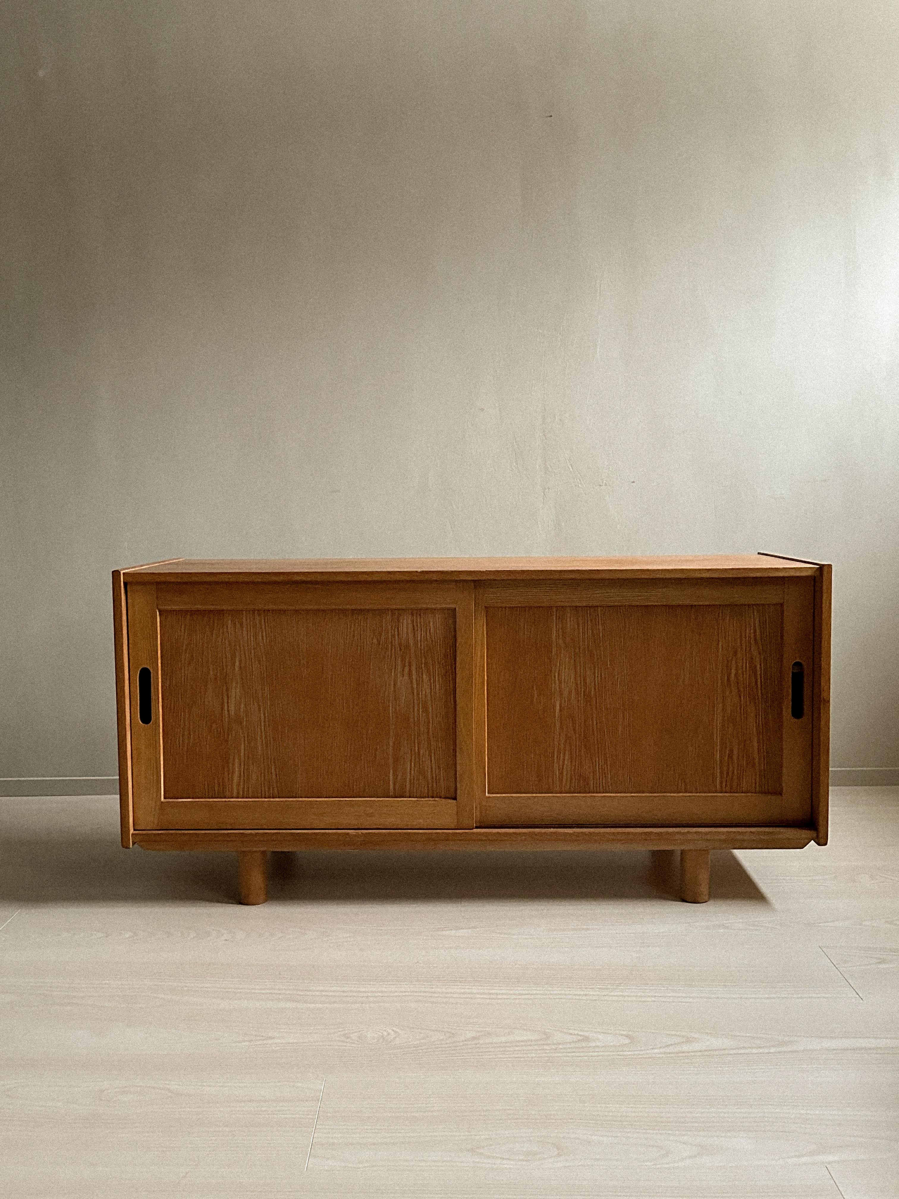 Mid-Century Modern A small oak sideboard with round feet, Norway c. 1960s For Sale