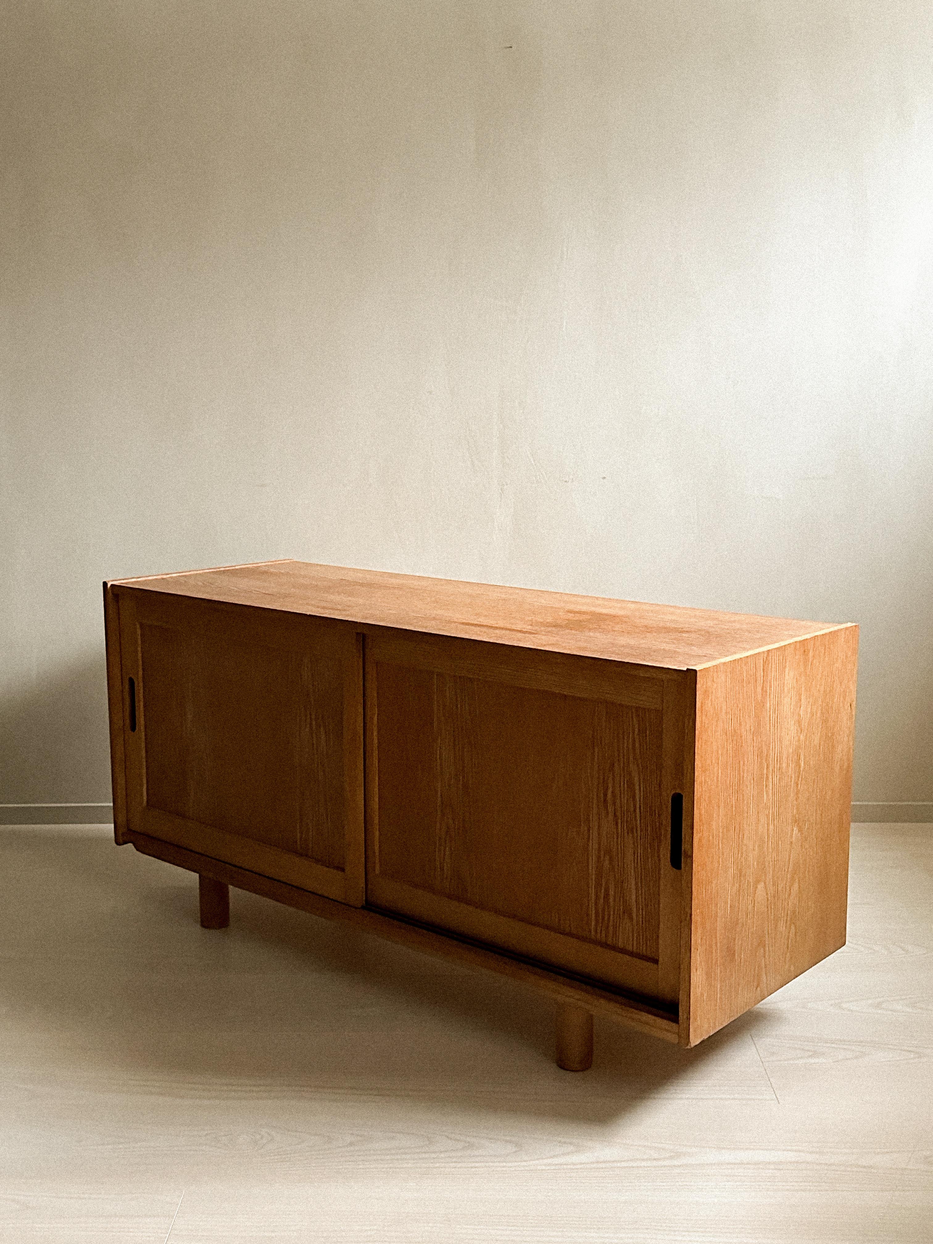 Norwegian A small oak sideboard with round feet, Norway c. 1960s For Sale