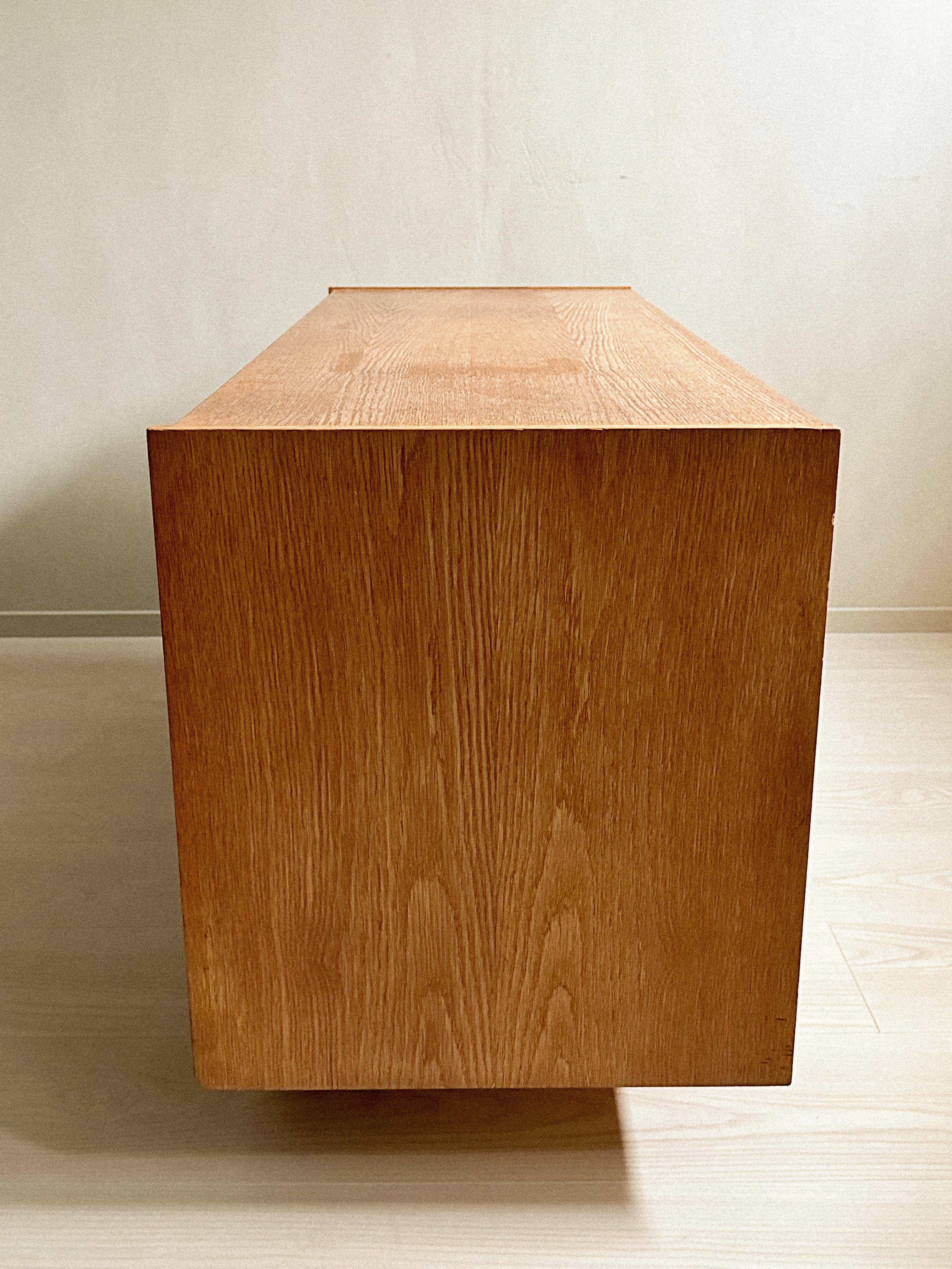 A small oak sideboard with round feet, Norway c. 1960s For Sale 1