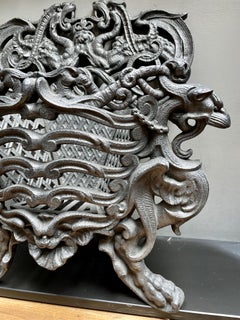 A Small  Ornate French Cast Iron Coal Grate